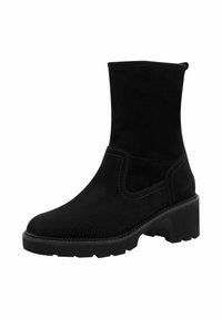 Bota de ante negra hasta el tobillo con tacón cuadrado, panel lateral elástico y costuras blancas contrastantes. Textura suave y diseño contemporáneo y elegante.