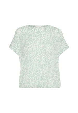 Hellgrünes Oberteil mit kurzen Ärmeln, das mit einem weißen Blumenmuster versehen ist. Rundhalsausschnitt und lässige Passform, aus einem weichen, leichten Stoff gefertigt.