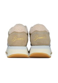 Beige suede sneakers with a plush pink lining. Features a layered sole with cream and orange accents and gold "Sun68" logo on the heel.