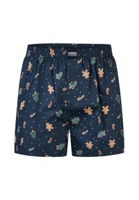 Navy modré boxerky se vánočním vzorem zobrazujícím perníkové muže, cukrové tyčinky a ozdobené vánoční stromy.