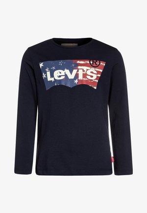 Chemise à manches longues bleu marine avec le logo Levi's usé en rouge, blanc et bleu, ressemblant à un drapeau américain sur le devant.