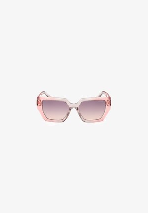 Hexagonal sunglasses with clear pink frames and gradient lenses, featuring angular design and subtle branding on the lens.