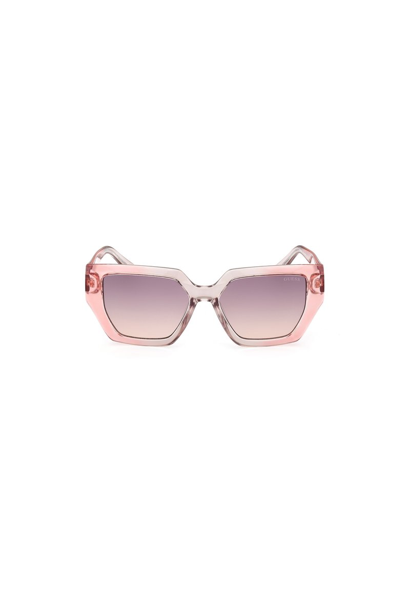 Ochelari de soare hexagonali cu rame roz clare și lentile cu gradient, având un design unghiular și o marcaj subtil pe lentilă.