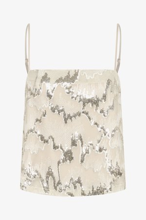 Bez piedurknēm topiņš ar krējuma krāsu, rotāts ar viļņotu sudraba sekvīnu rakstu, gluda tekstūra un plānas regulējamas siksniņas.