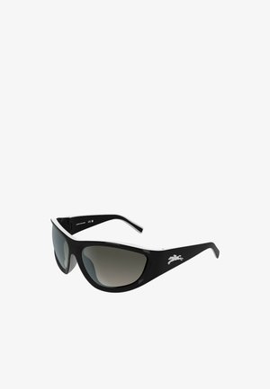 Occhiali da sole con montatura nera, lenti grigie scure sfumate e un accento bianco lungo il bordo superiore. Presentano un logo sulla stanghetta.
