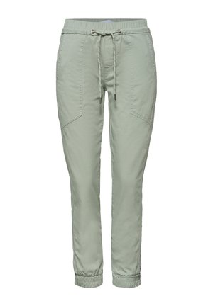 Lichtgroene casual broek met elastische tailleband en trekkoorden, gestikte voorkanten zakken en elastische boorden bij de enkels.