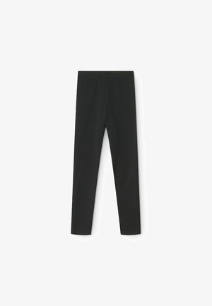 Zwarte leggings van een gladde, rekbare stof. Kenmerkt zich door een hoge tailleband en een nauwsluitend ontwerp, geschikt voor verschillende activiteiten.