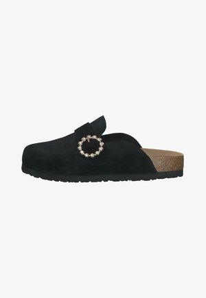 Black suede slip-on shoe with a round metal buckle and a cork footbed. The sole is textured for grip. Smooth upper and minimalist design.