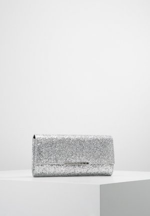 Silver glitter clutch purse with a rectangular shape and flap closure placed on a white pedestal against a plain background.