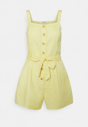 Yellow sleeveless romper with front buttons and a tied waist belt, featuring wide shoulder straps and pleated shorts.