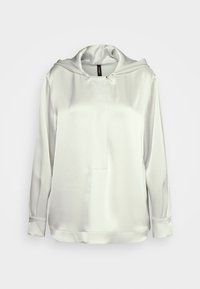 Silk-like white hooded top with a front placket, long sleeves, and smooth texture. Minimalist design with no visible patterns or hardware.