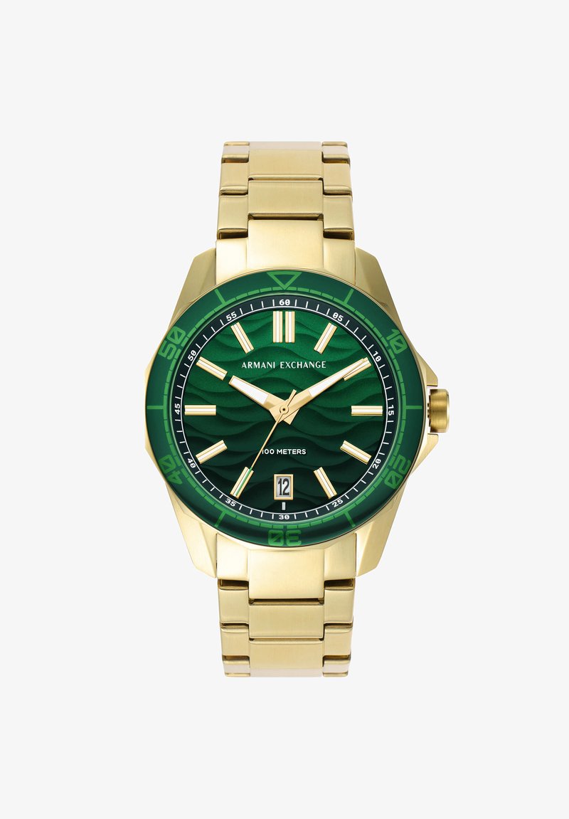 Gold-tone wristwatch with a green textured dial, luminous hands, oversized numbers, and a date display. Features a linked bracelet design.