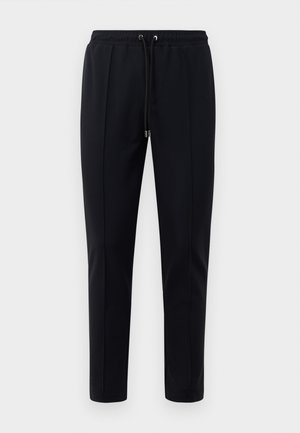 CITY PANTS - Jogginghose - black