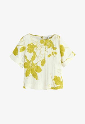Hvid kortærmet bluse med brede ærmer og stort gult blomsterprint samt rund halsudskæring med lynlås i ryggen.