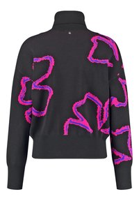 Svart tröja med hög krage och ljusrosa abstrakta mönster. Har långa ärmar och en avslappnad passform.