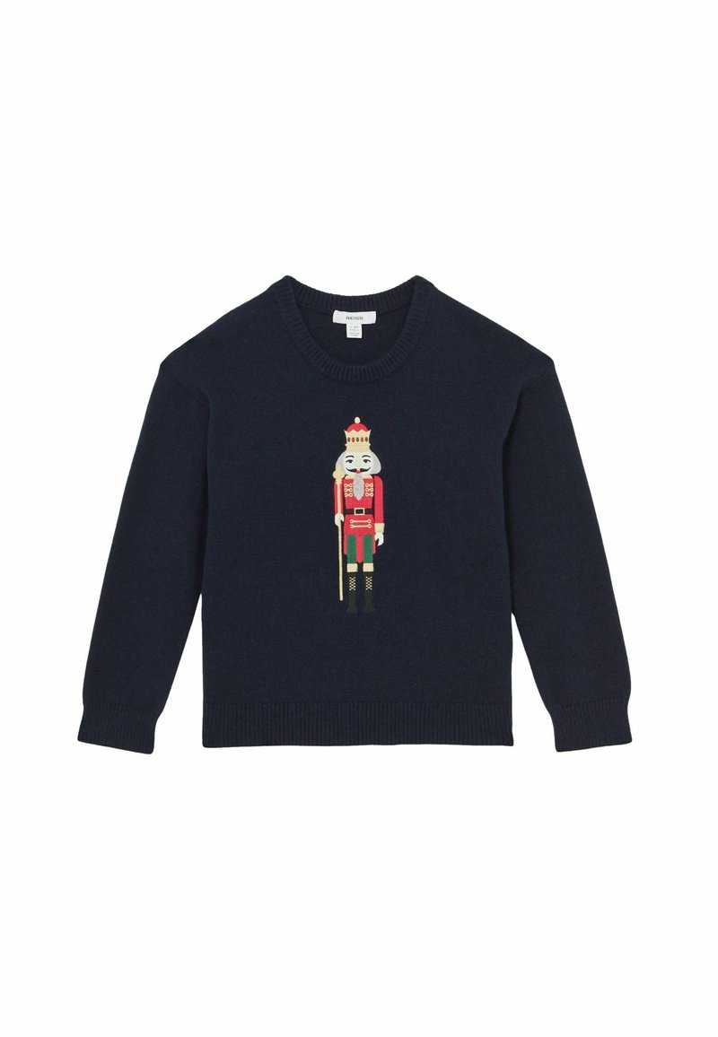 Tamsiai mėlynas megztinis su riešuto laužiklio dizainu raudona, žalia ir kreminė spalvomis. Yra apvalus iškirpimas, taip pat gumuoti rankogaliai ir apatinė dalis.