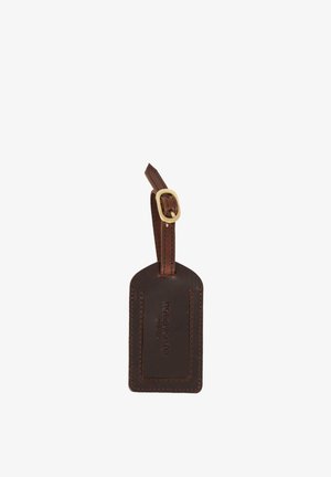 Brown leather luggage tag with stitched edges, embossed brand name, and adjustable strap with gold buckle.