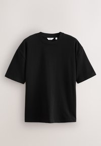 Czarny, krótkorękawowy t-shirt z okrągłym dekoltem o luźnym kroju, prezentowany na jasnym, jednolitym tle.