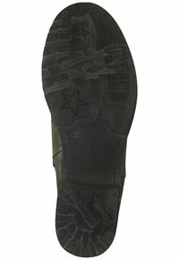 Semelle de chaussure en caoutchouc noir avec une texture antidérapante et des motifs, incluant des étoiles et un motif de cheval ; présente une forme courbée et des bords lisses.