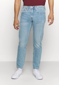 Levi's® 502™ TAPER - Calças de ganga de corte afunilado - light-blue denim