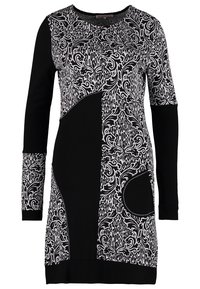 Robe monochrome à manches longues avec un motif patchwork mêlant fleurs et formes abstraites, et un col rond.