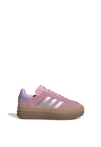 Pink suede sneaker with silver three stripes, textured tongue, and lavender heel accent. Features a thick gum rubber sole for added height.