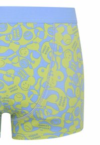 Boxer shorts bleu clair et vert lime avec des motifs de visages souriants. Dotés d'une taille douce et d'une texture de tissu lisse.