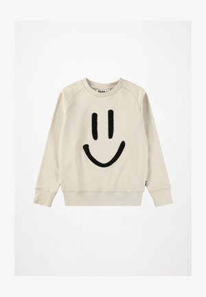 Svetlo bež sweatshirt z velikim črnim nasmejanim obrazom. Ima rebraste manšete in okrogel izrez, izdelan iz mehkega bombažnega materiala.