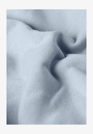 Light blue soft fabric with fine knit texture, shown in gentle folds and creases.