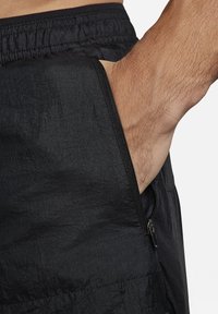 Nike Performance RUN STRIDE - Pantalón corto de deporte - black black