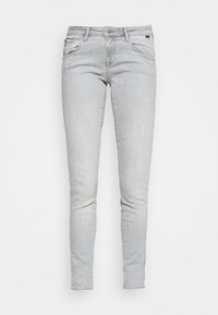 Ljust grå skinny jeans i denim, med en standard femfickorsdesign, lätt slitage och en traditionell knappstängning.