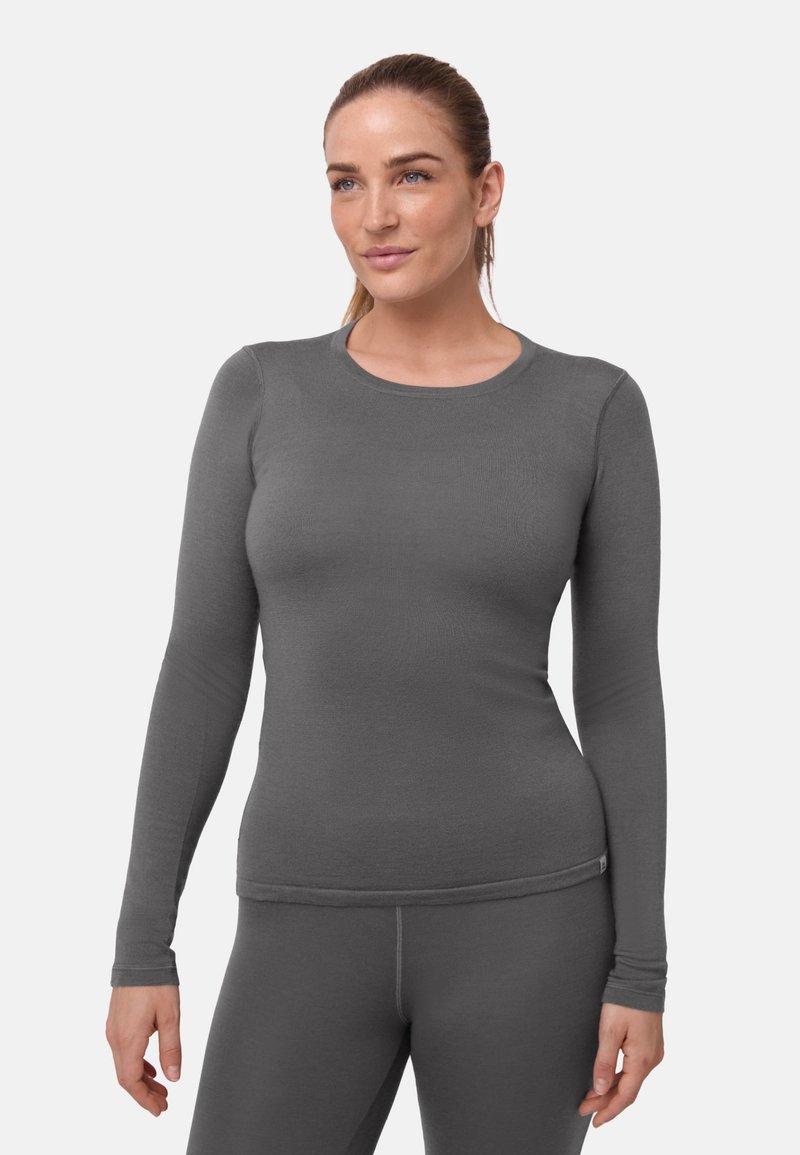 Eng anliegendes Langarmshirt in Dunkelgrau aus einem glatten, elastischen Stoff. Mit rundem Ausschnitt und dezenten Nähten entlang der Ärmel und am Saum.