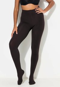 Collant neri opachi con un alto girovita. Realizzati in un materiale morbido e elastico, hanno una superficie liscia e un design senza cuciture.