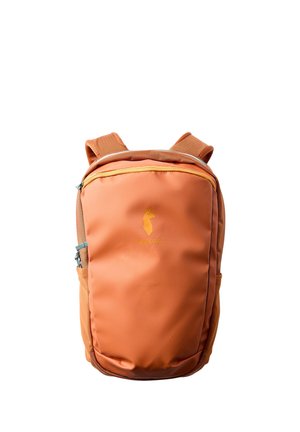 Orange compact backpack with padded shoulder straps and a small yellow logo of an animal on front pocket.