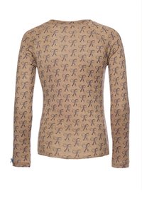 Top z długim rękawem w jasnobrązowym materiale, zdobiony powtarzającym się wzorem kokardek w ciemnobrązowym kolorze, z małym niebieskim akcentem kokardki przy mankiecie.