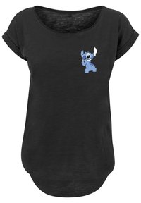 Camiseta negra de diseño holgado, con un personaje de dibujos animados azul impreso en el área del pecho izquierdo. Mangas cortas enrolladas y dobladillo redondeado.