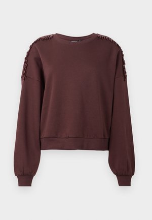 Brown sweatshirt with long sleeves, round neckline, and textured decoration on shoulders. Ribbed cuffs and hem. Soft fabric.