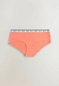 Sous-vêtements hipster pour femmes de couleur corail avec une ceinture élastique blanche ornée du texte noir "NEXT" répété.