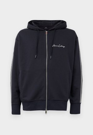 Navy blue hooded zip-up sweatshirt with white side stripes and "Armani Exchange" logo on the left chest.