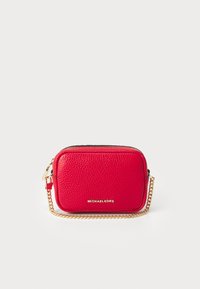 Red leather crossbody bag with a textured finish, gold-tone chain strap, zip closure, and embossed brand logo on the front.
