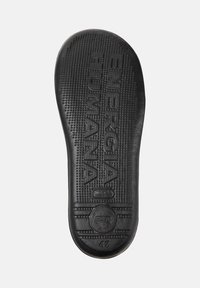 Black shoe insole featuring textured surface and embossed brand inscriptions, size 42, centered on a plain background.