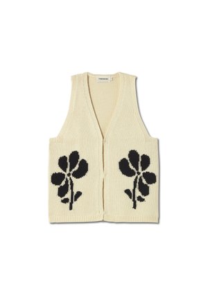 Gilet en tricot crème avec un col en V, présentant des motifs floraux noirs sur les panneaux avant. Sans manches, avec une texture en relief et une ouverture à l'avant.