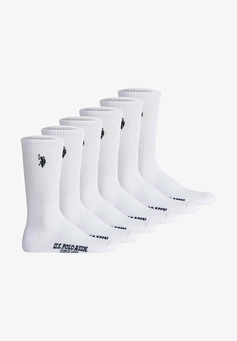 Calze in cotone bianche in confezione da sei. Texture a coste, lunghezza alla caviglia con logo nero e nome del marchio stampati sulla suola.