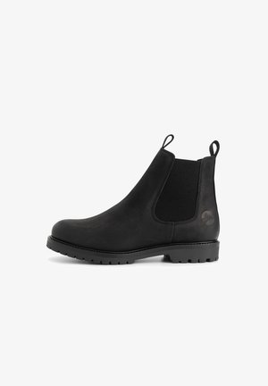 Bottines Chelsea en cuir noir avec des panneaux élastiques sur les côtés, des languettes à l'avant et à l'arrière, et une semelle lug texturée.