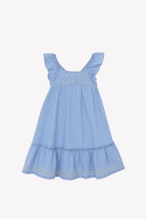Light blue chambray dress with embroidered sun and palm tree, ruffled straps, and a tiered skirt with lace trim detailing at the hem.