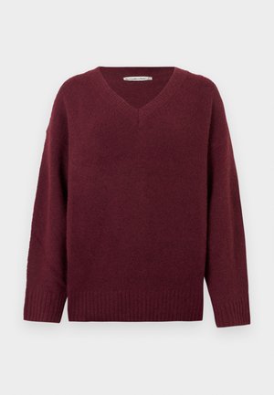 Bordový sveter s výstrihom do V, vyrobený z mäkkého, textúrovaného materiálu so širokými rukávmi a rebrovaným lemom. Jednoduchý, klasický dizajn bez ozdôb.