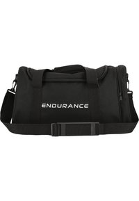 Mustaväri duffel-laukku, joka on valmistettu kestävästä kankaasta. Varustettu vetoketjullisella sulkimella, pehmustetuilla kahvoilla ja säädettävällä olkahihnalla. "ENDURANCE"-logo näkyvästi esillä.