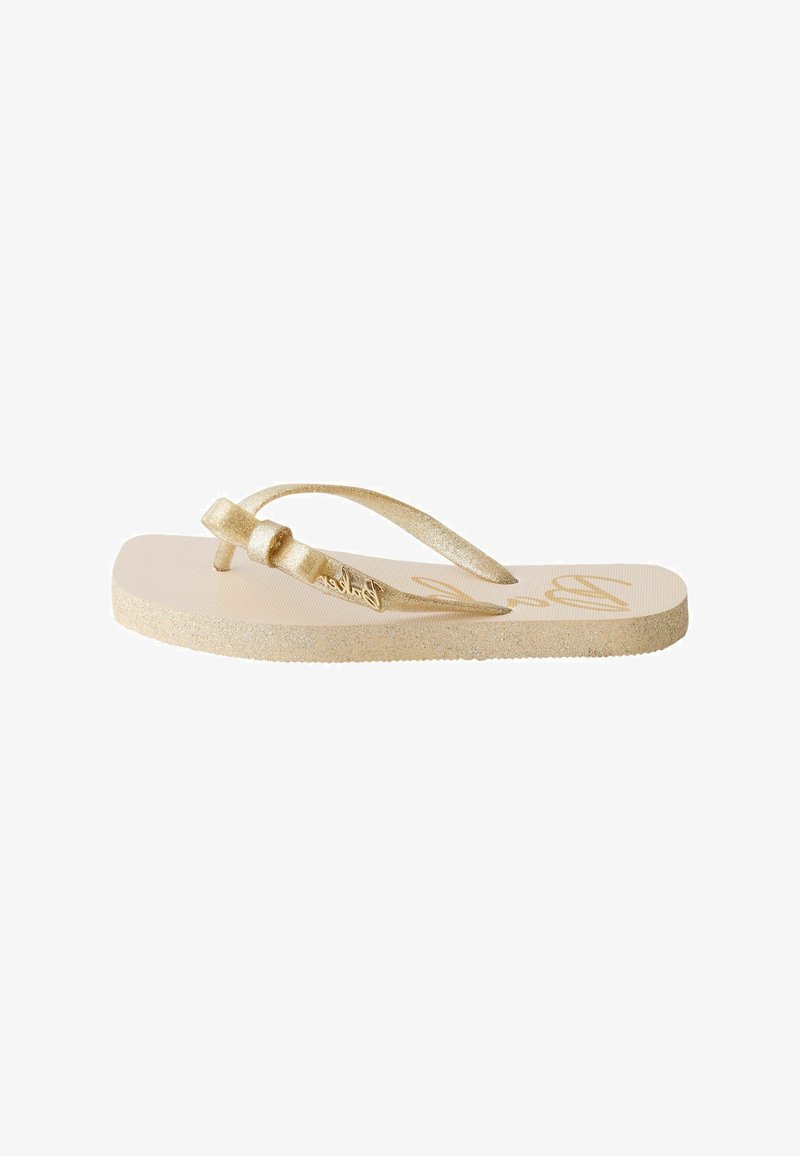 Sandale flip-flop à paillettes dorées avec fines lanières et un détail nœud décoratif sur fond blanc.