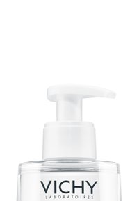 Clear plastic pump bottle with a white pump top, featuring a label that reads "VICHY LABORATOIRES," designed for dispensing liquid products.