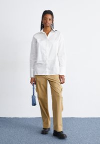 The North Face HIGH LOW - Pogājama blūze - white